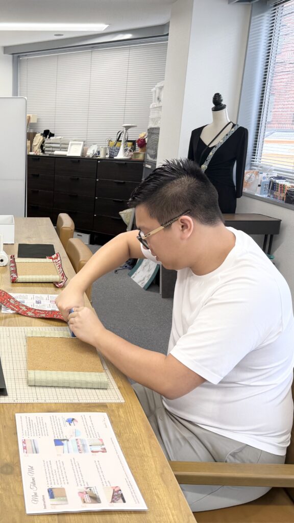 Mother and son enjoying a tatami-beri craft workshop in Osaka